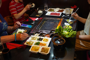 A bunch of friends eating at Mommy Thai fulfilling their winter cravings